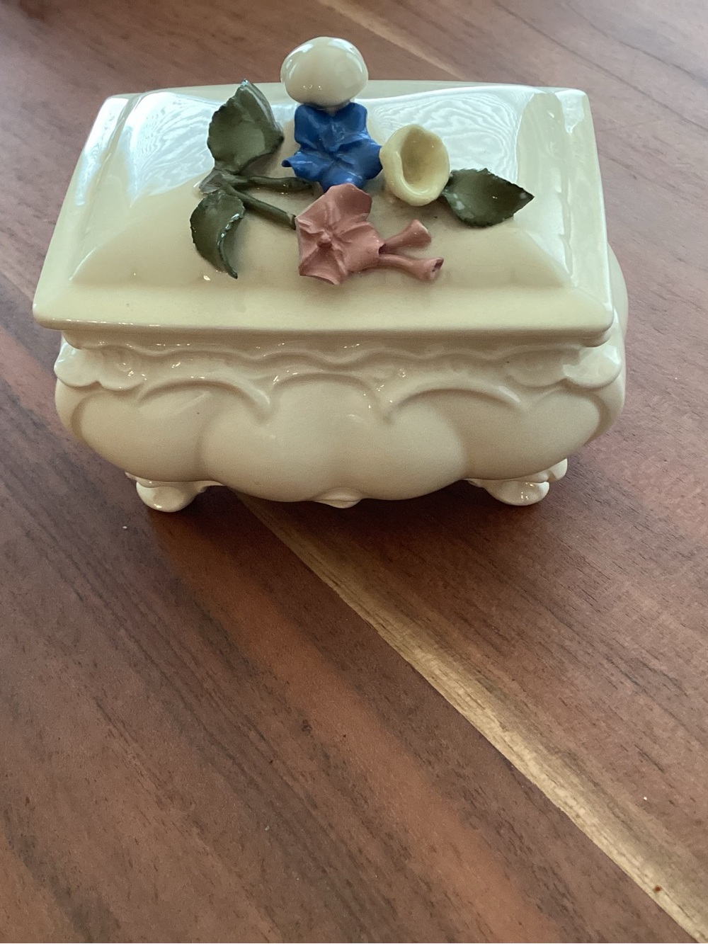 Antique. Porcelain footed trinket box ivory glazed finish and 3 D applied floral